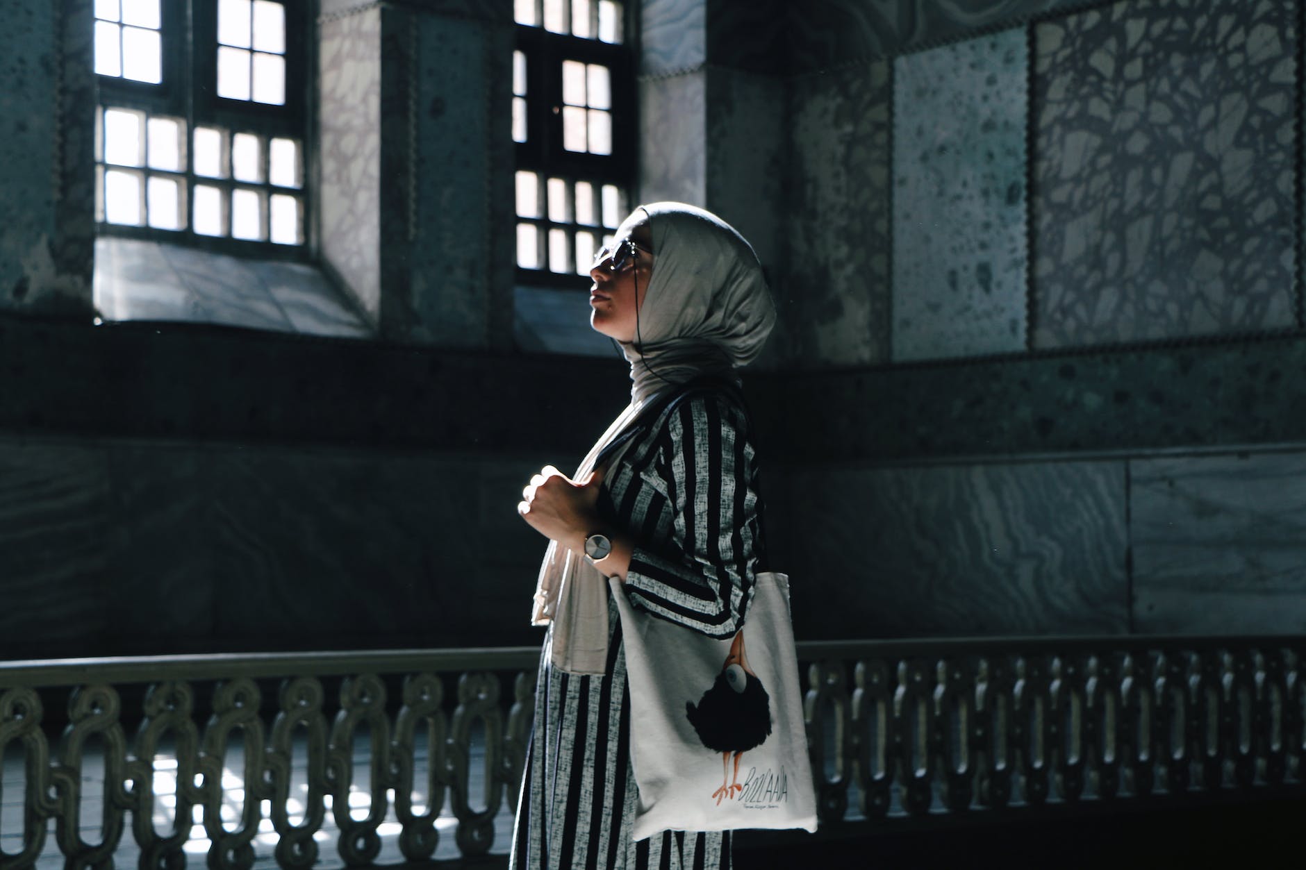 woman in a hijab standing in a building